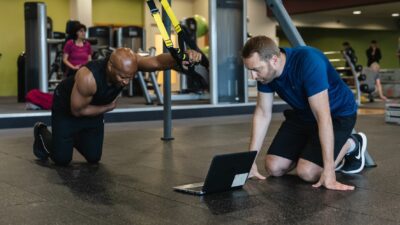 Personal trainer and client resistance training