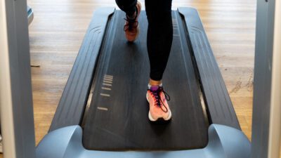 woman's feet running on a treadmill